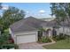 One-story home with a large yard, and a two-car garage at 3528 Chapel Hill Blvd, Clermont, FL 34711