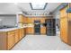 Kitchen with light wood cabinets, stainless steel appliances and white countertops at 3528 Chapel Hill Blvd, Clermont, FL 34711