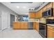 Kitchen with wood cabinets, stainless steel appliances and tile floor at 3528 Chapel Hill Blvd, Clermont, FL 34711