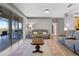 Bright living room featuring a comfortable couch and access to a serene outdoor patio at 3528 Chapel Hill Blvd, Clermont, FL 34711