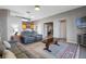 Open living area showcasing gray couches, a coffee table, and a view into another room at 3528 Chapel Hill Blvd, Clermont, FL 34711