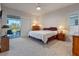 Main bedroom with king-size bed and access to the patio at 3528 Chapel Hill Blvd, Clermont, FL 34711