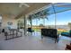 Spacious screened patio overlooking lake with seating at 3528 Chapel Hill Blvd, Clermont, FL 34711