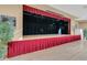 Spacious community stage with red curtains at 3528 Chapel Hill Blvd, Clermont, FL 34711