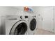 Bright laundry room with LG washer and dryer, and ample shelving at 5001 Whitewater Way, Saint Cloud, FL 34771