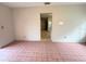 Living room with tile floor and view of kitchen at 5165 Gwynne Ave, Orlando, FL 32810