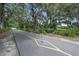 Scenic paved pathway shaded by lush trees and Spanish moss at 522 S Woodland St, Winter Garden, FL 34787