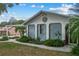 Front exterior of a single-Gathering home with blue siding and decorative accents at 6433 Wynglow Ln, Orlando, FL 32818