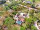 Stunning home with a pool, surrounded by lush greenery and a large lot at 660 Ferne Dr, Longwood, FL 32779