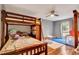 bedroom with bunk bed, play area, and hardwood floors at 660 Ferne Dr, Longwood, FL 32779