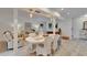 Bright dining area with a white table and chairs, adjacent to the living room at 660 Ferne Dr, Longwood, FL 32779