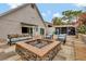 Relaxing patio with fire pit, surrounded by lush landscaping at 660 Ferne Dr, Longwood, FL 32779