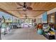 Large screened porch with ceiling fan and plenty of space for relaxation at 660 Ferne Dr, Longwood, FL 32779