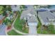 Two-story house with a gray roof and pool at 8100 Fan Palm Way, Kissimmee, FL 34747