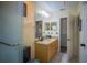 Bathroom with granite countertop, tub shower combo and updated fixtures at 8100 Fan Palm Way, Kissimmee, FL 34747