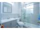 Updated bathroom with a walk-in shower and gray vanity at 8100 Fan Palm Way, Kissimmee, FL 34747
