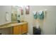 Bathroom with granite countertop and updated vanity at 8100 Fan Palm Way, Kissimmee, FL 34747