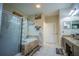 Bathroom with soaking tub, glass shower, and granite vanity at 8100 Fan Palm Way, Kissimmee, FL 34747