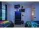 Bedroom with TV, dresser, and two twin beds at 8100 Fan Palm Way, Kissimmee, FL 34747