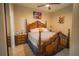 Spacious bedroom with a large wooden bed frame at 8100 Fan Palm Way, Kissimmee, FL 34747