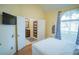 Bedroom with view of entryway and a comfortable bed at 8100 Fan Palm Way, Kissimmee, FL 34747