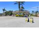 Gated community entrance with designated areas for residents and guests at 8100 Fan Palm Way, Kissimmee, FL 34747