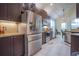 Spacious kitchen with stainless steel appliances and granite countertops at 8100 Fan Palm Way, Kissimmee, FL 34747