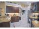 Modern kitchen featuring dark wood cabinets and granite countertops at 8100 Fan Palm Way, Kissimmee, FL 34747