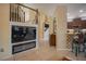 Living room with a built-in electric fireplace and staircase at 8100 Fan Palm Way, Kissimmee, FL 34747