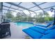 Large pool with plenty of lounge chairs for sunbathing at 8100 Fan Palm Way, Kissimmee, FL 34747