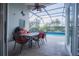 Enjoy dining al fresco overlooking the refreshing pool at 8100 Fan Palm Way, Kissimmee, FL 34747