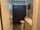 Bathroom with shower/tub combo, toilet, and vanity at 10470 Sw 99Th Ct, Ocala, FL 34481