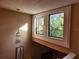 Upper level landing with two windows and a light fixture at 108 Scottsdale Sq # 108, Winter Park, FL 32792