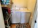 Laundry room with washer, dryer, and shelving at 108 Scottsdale Sq # 108, Winter Park, FL 32792