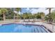Inviting community pool with lounge chairs and gazebo at 108 Scottsdale Sq # 108, Winter Park, FL 32792