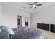 Main bedroom with king bed, walk-in closet and dresser at 1423 Amber Leaf Cir, Ocoee, FL 34761