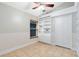 Bright bedroom with hardwood floors, built-in shelving and closet at 1455 Creekside Cir, Winter Springs, FL 32708