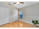 Well-lit bedroom with hardwood floors and double closets at 1455 Creekside Cir, Winter Springs, FL 32708