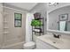 Clean bathroom with a shower/tub combo, vanity, and linen storage at 1608 Bomi Cir, Winter Park, FL 32792