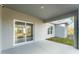 Covered back patio with sliding glass doors at 1609 Pickerel Ct, Kissimmee, FL 34759