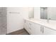 Modern bathroom with double vanity, marble tile, and shower at 1609 Pickerel Ct, Kissimmee, FL 34759