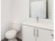 Clean bathroom with white vanity, toilet, and modern fixtures at 1609 Pickerel Ct, Kissimmee, FL 34759