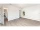 Spacious bedroom with vinyl plank flooring and large window at 1609 Pickerel Ct, Kissimmee, FL 34759