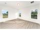 Spacious bedroom with vinyl flooring and multiple windows at 1609 Pickerel Ct, Kissimmee, FL 34759