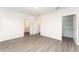 Well-lit bedroom featuring vinyl flooring and en-suite bathroom at 1609 Pickerel Ct, Kissimmee, FL 34759