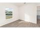 Sunny bedroom with vinyl flooring and window view at 1609 Pickerel Ct, Kissimmee, FL 34759