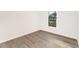 Simple bedroom featuring vinyl flooring and a window at 1609 Pickerel Ct, Kissimmee, FL 34759