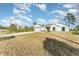 New construction home with gray siding and a concrete driveway at 1609 Pickerel Ct, Kissimmee, FL 34759