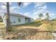 House exterior with a side yard and a partly sunny sky at 1609 Pickerel Ct, Kissimmee, FL 34759