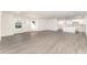 Spacious living room with hardwood floors and an open kitchen at 1609 Pickerel Ct, Kissimmee, FL 34759